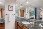 The master bathroom features two vanities with sinks, a large oversized soaking tub and separate walk-in shower